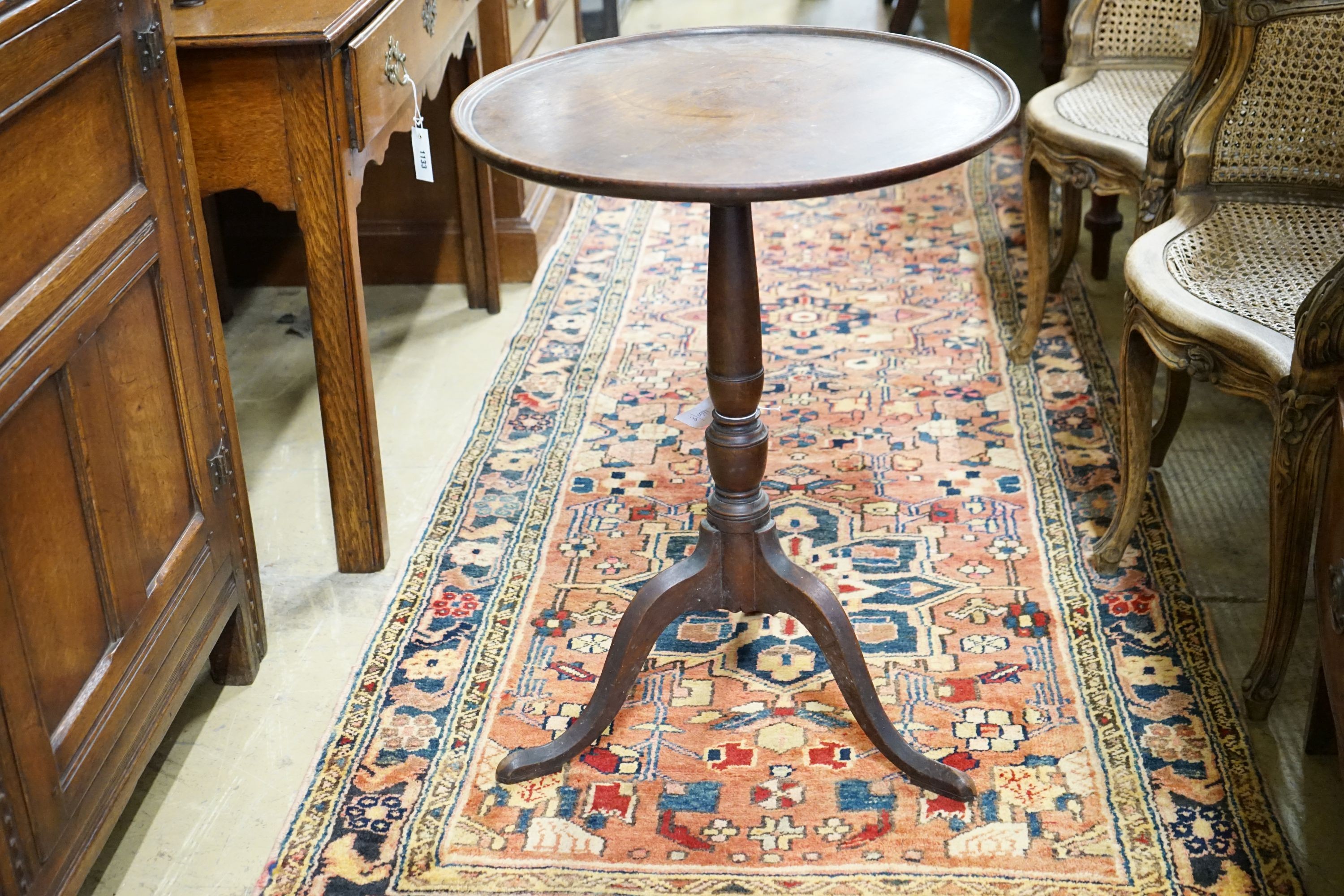 A George III mahogany tilt top tripod table, diameter 53cm, height 71cm (a.f.)